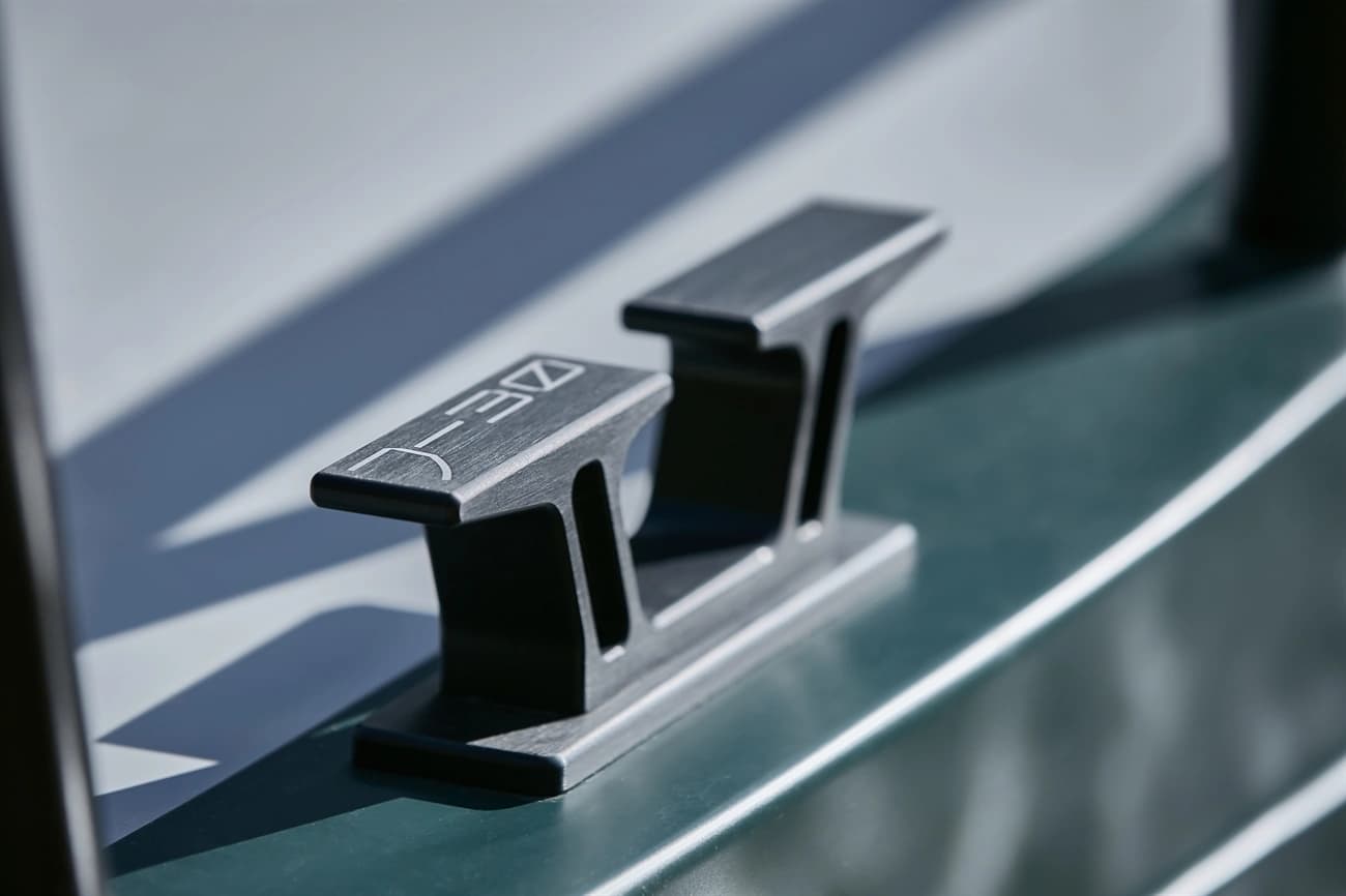 Black pop-up cleat installed on a boat’s deck edge